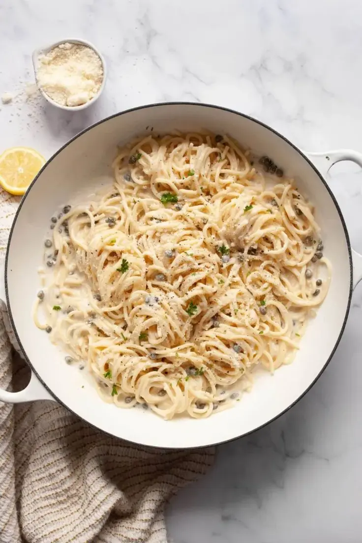 Creamy Lemon Caper Pasta Recipe by Healthful Blondie - This Lemon Caper Pasta is a satisfying dish that stays under 400 calories, with tangy citrus flavor, briny capers, and a light sauce. Bright, zesty, and perfect for guilt-free comfort food, it’s a low-calorie dream come true!
