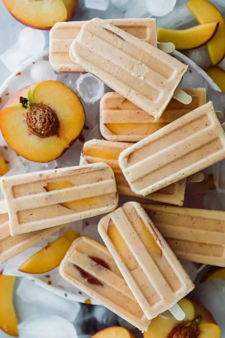10. New Peaches and Cream Smoothie Popsicles by Oh Delicioso
