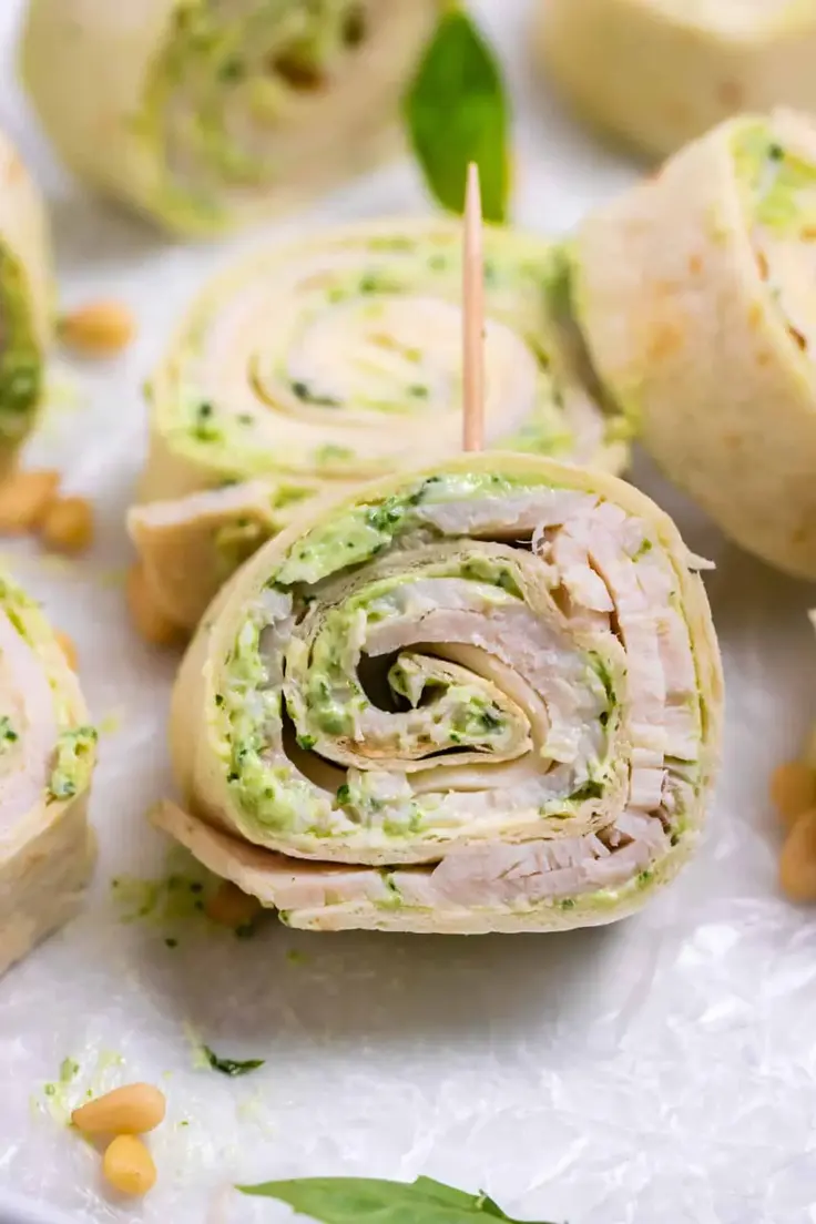 These Turkey Pesto Pinwheels with Smoked Provolone are loaded with fresh pesto sauce, oven-roasted turkey breast, and smoky provolone cheese, all rolled up in a soft tortilla.