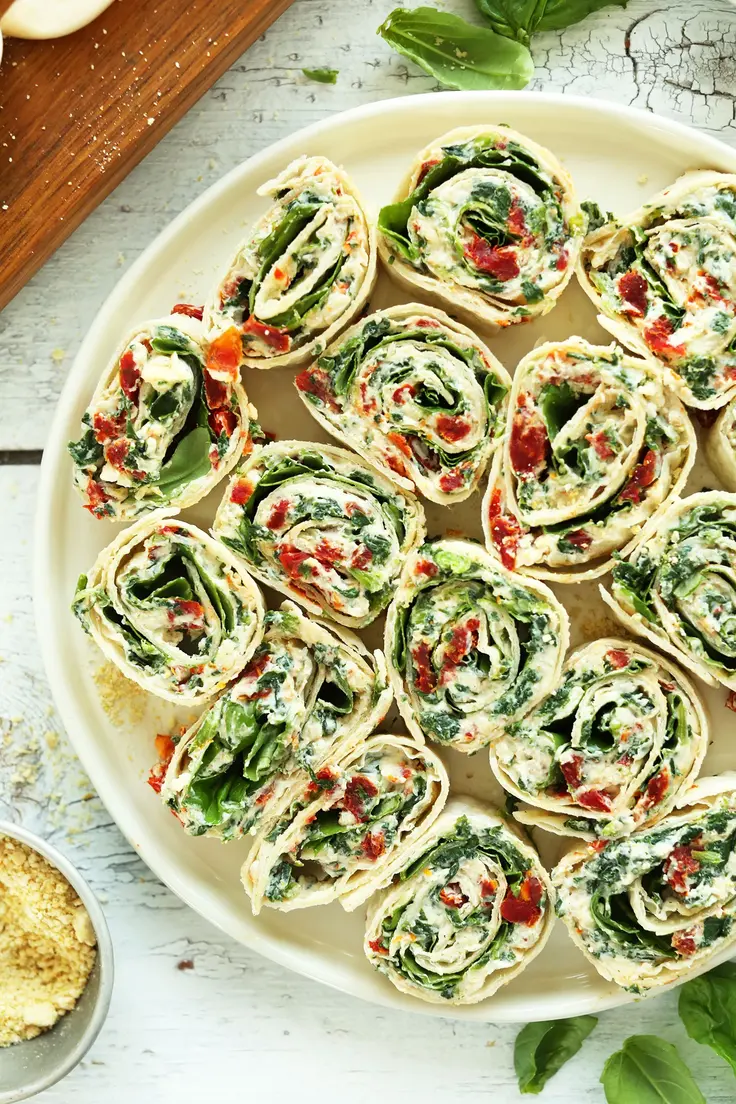 With just 15 minutes and 8 ingredients, you can create Sun-Dried Tomato and Basil Pinwheel Appetizers.