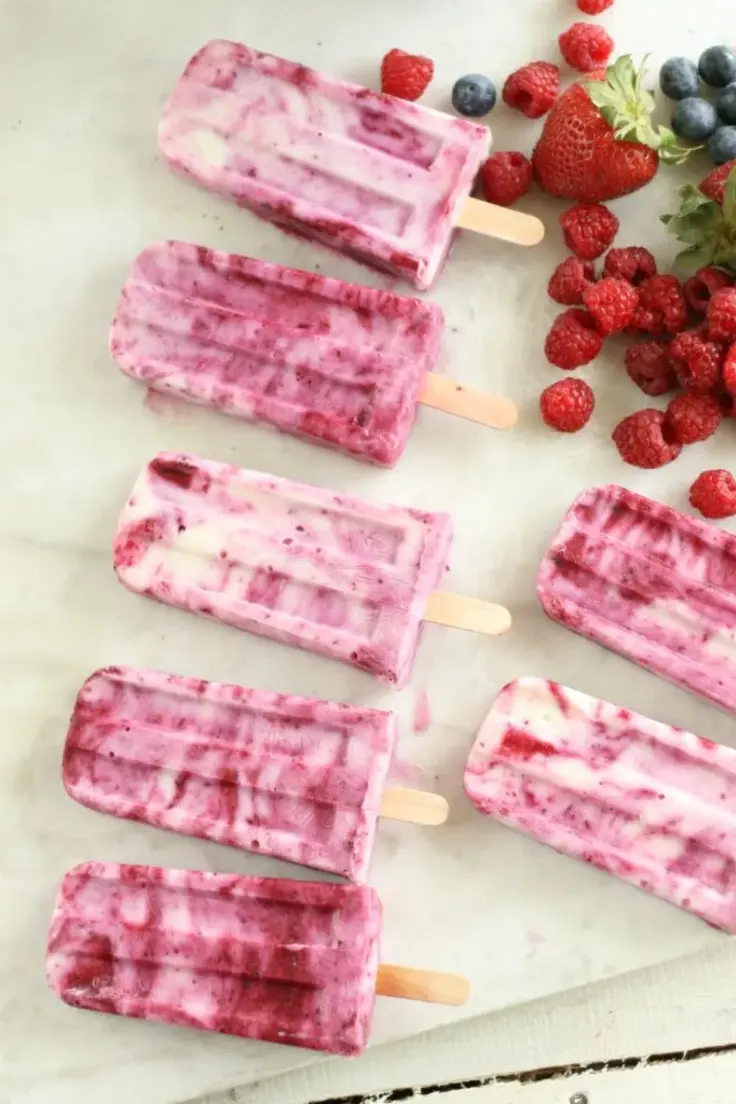 13. Berry Swirl Yogurt Popsicles by A Farm Girls Kitchen (Easy summer popsicle recipes)
