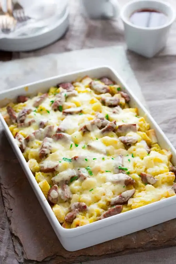 15. Apple Cheddar and Sausage Breakfast Strata by Healthy Seasonal Recipes is a savory and sweet make-ahead breakfast casserole that serves 10 people!

