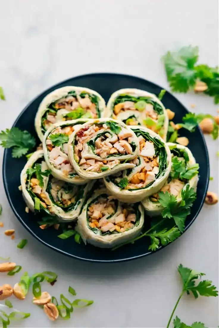 Enjoy the flavors of Thai cuisine with this easy-to-make, delicious, bite-sized pinwheel appetizers.