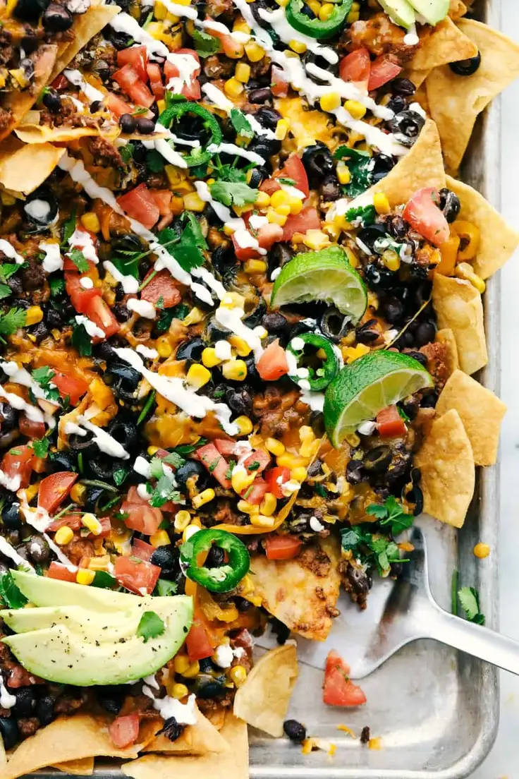 12. Oven Baked Sheet Pan Nachos by The Recipe Critic