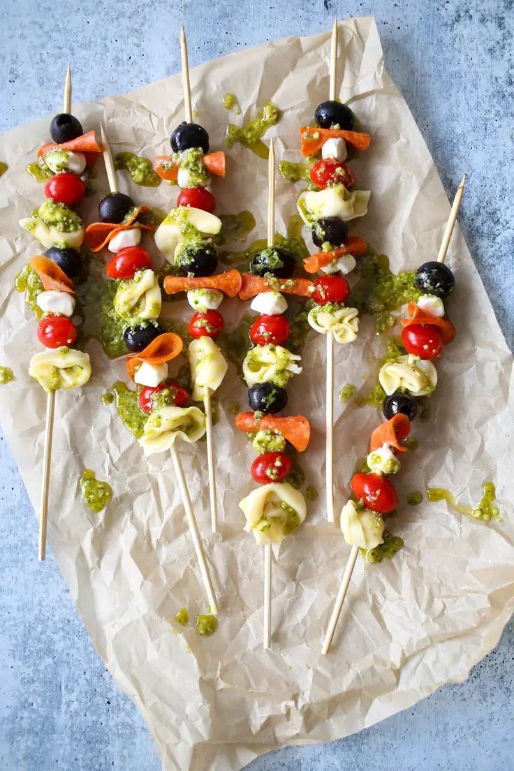 Easy Italian Tortellini Skewers Appetizer with Pesto Drizzle Recipe by Our Best Bites