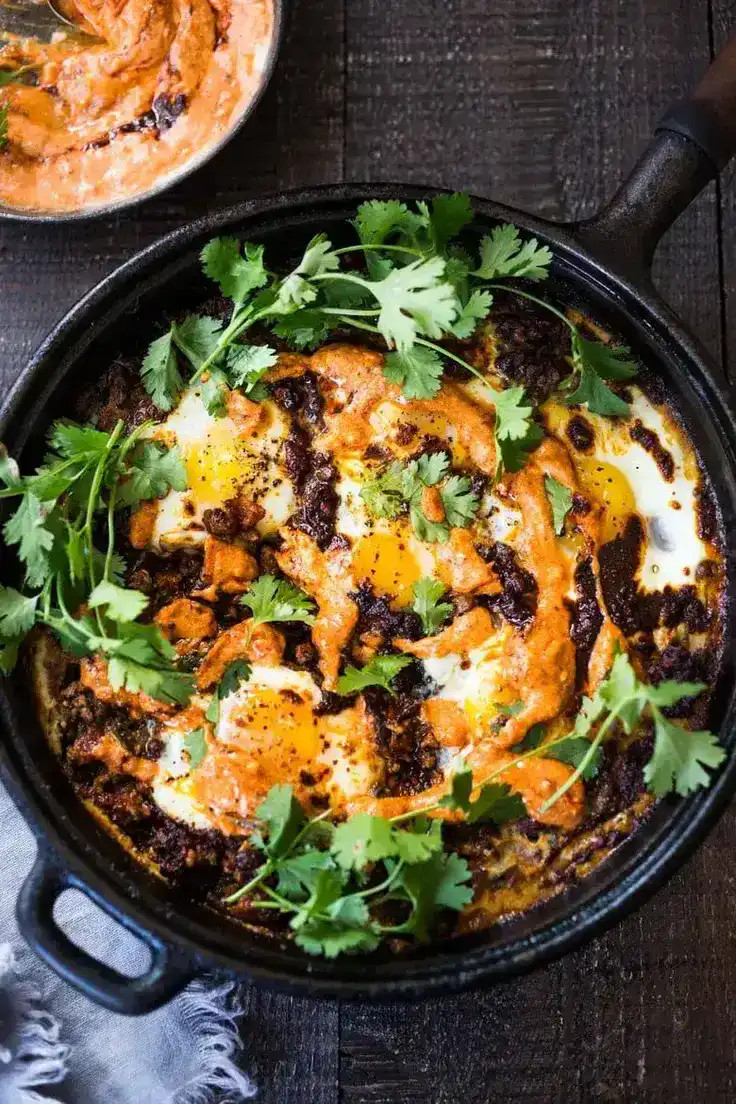 Moroccan Eggs with Lamb and Harissa yogurt Recipe by Feasting at Home - an exotic, satisfying, and delicious dish.